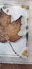 Handprinted maple leaf in white frame